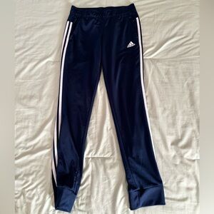 Woman’s Adidas size small straight leg joggers in navy blue with white stripes